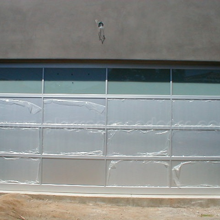 Glass garage doors in Santa Monica, California, providing a clear view and a sophisticated touch to residential architecture