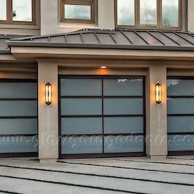 three single glass garage doors with dark frame and white glass in residential driveway