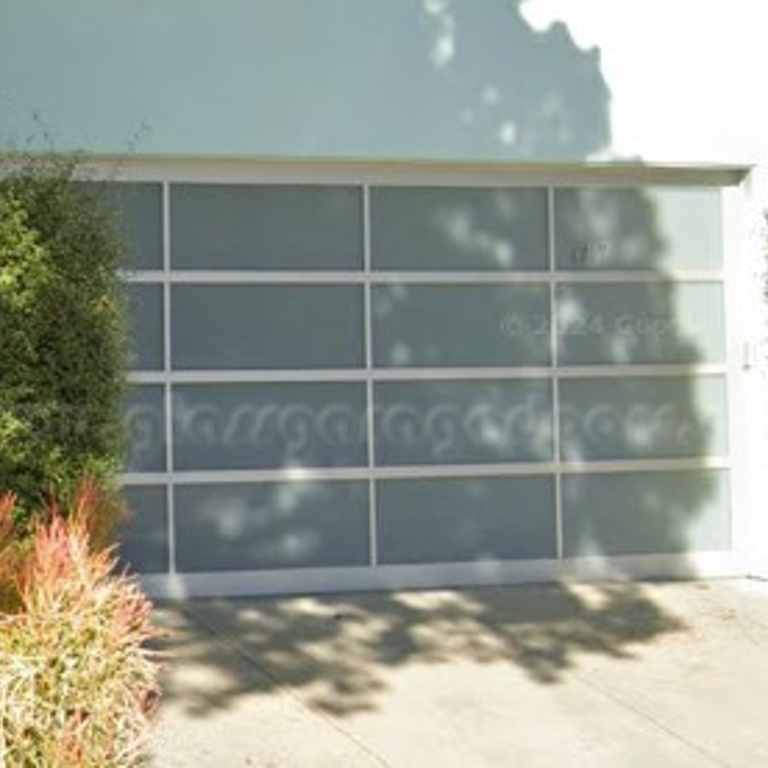 Elegant glass garage door installation at a modern home on montana avenue in  Santa Monica california