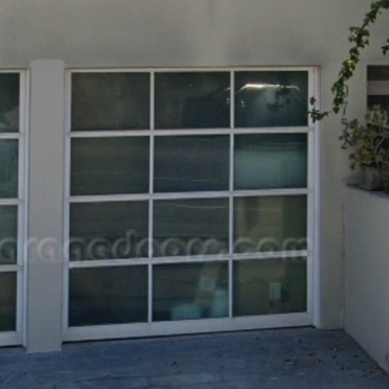 two white frame glass garage doors with matte glass