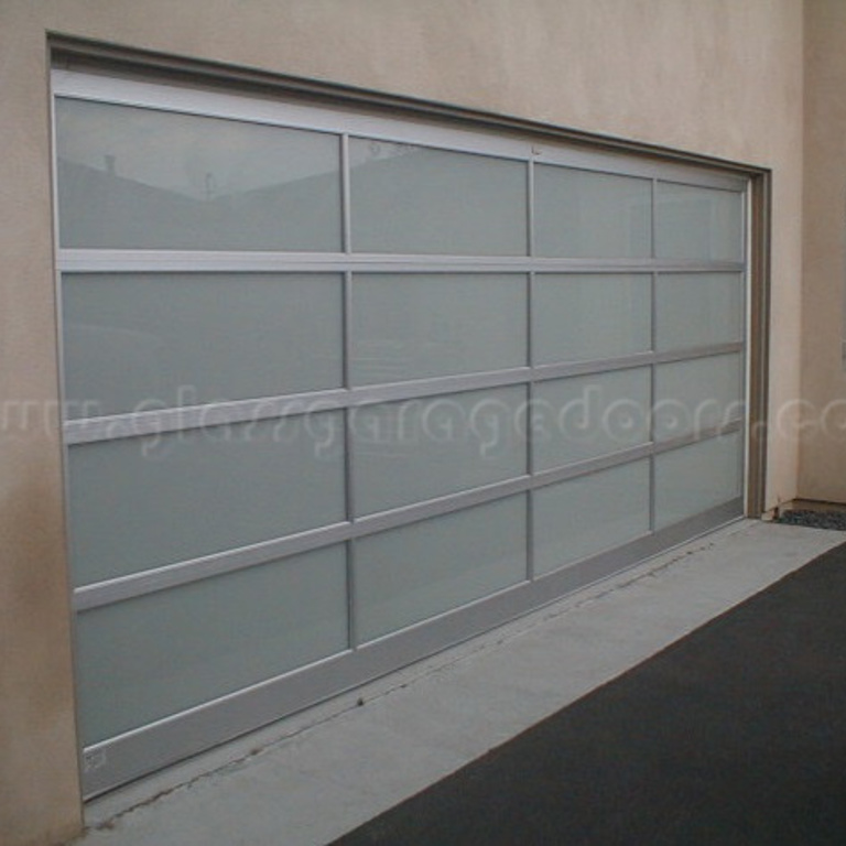 Santa Monica residence featuring a high-quality glass garage door