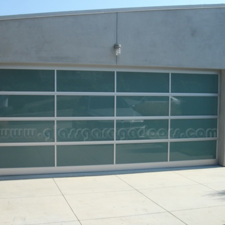 Modern residential glass garage door in Redondo Beach, California, with sleek design