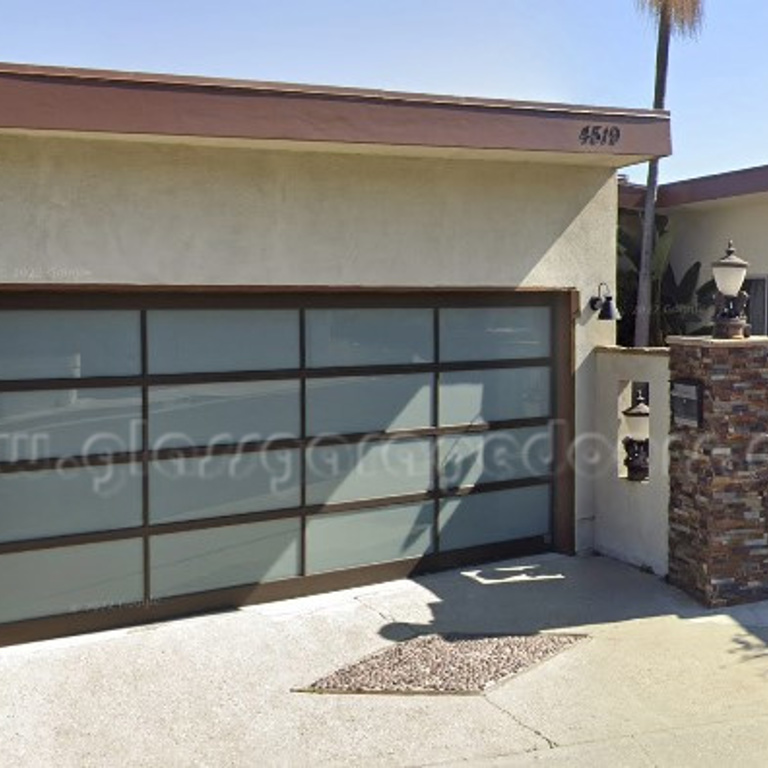 Contemporary glass garage door featured on a home along Don Arturo Place, Los Angeles, California