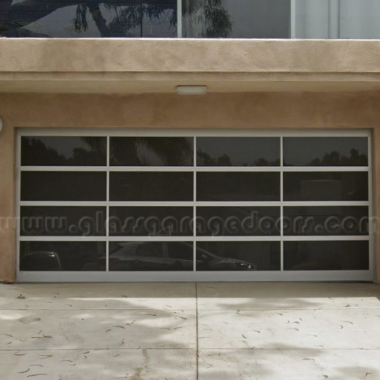 Custom-designed glass garage door in Redondo Beach, CA, featuring clean lines and a minimalist aesthetic