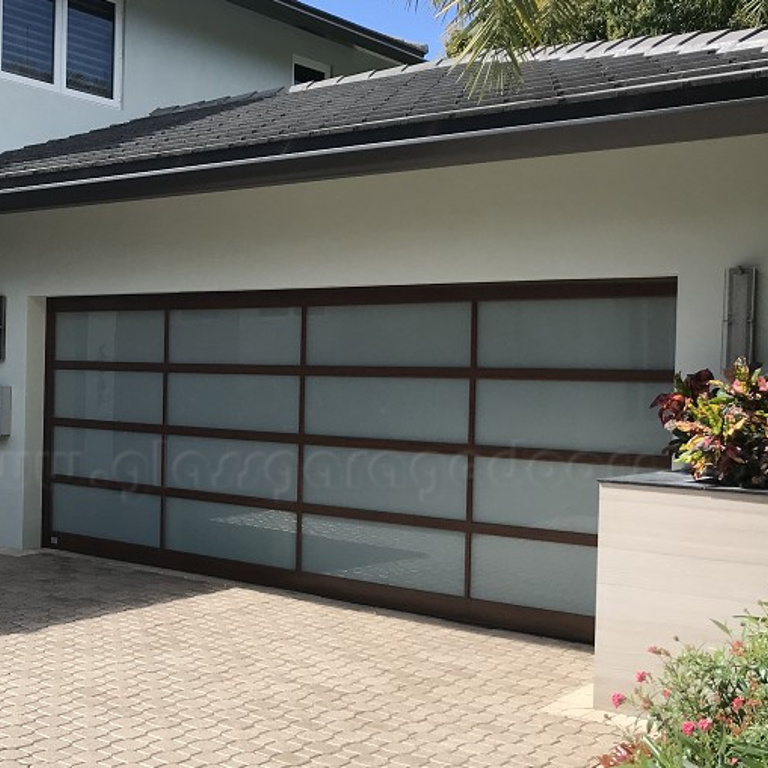 Brown Powder Coated glass garage doors installed in luxury home in fort lauderdale, florida