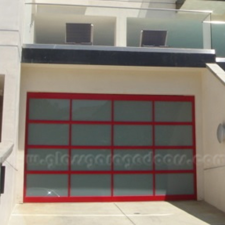 Vibrant red glass garage door installed on an apartment building in Pacific Palisades California