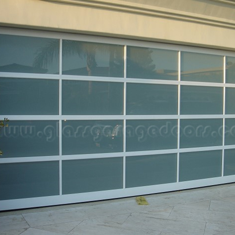 Modern white glass garage door providing secure access at Newport Beach residence