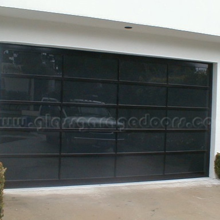 Luxury glass garage doors installed in a Santa Monica home, combining functionality with aesthetic appeal