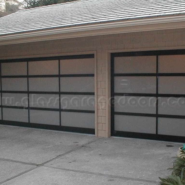 Elegant pair of glass garage doors providing stylish entry at Newport Beach residence in California