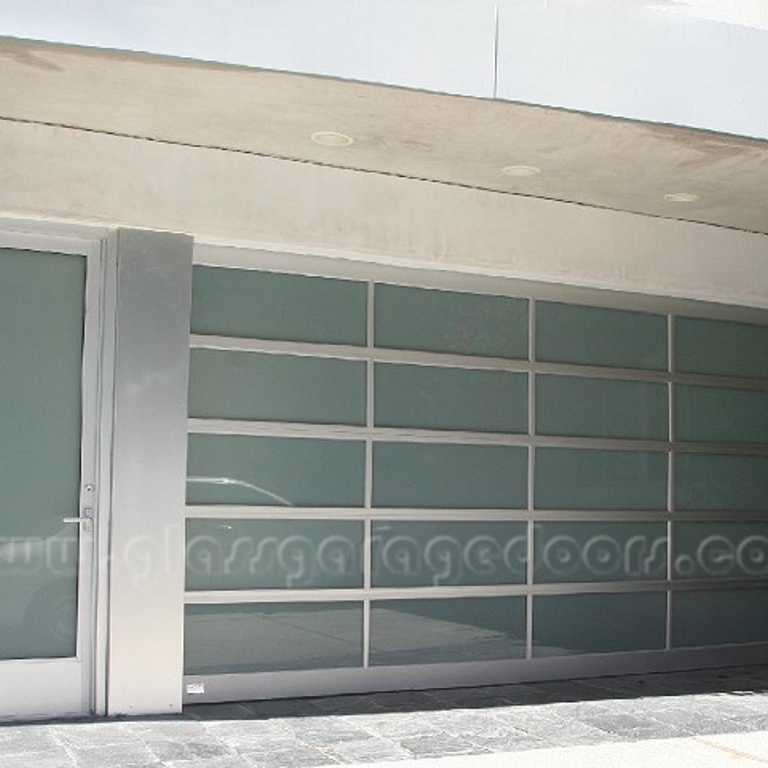 Sleek glass garage door with entry door on a contemporary Beverly Hills home