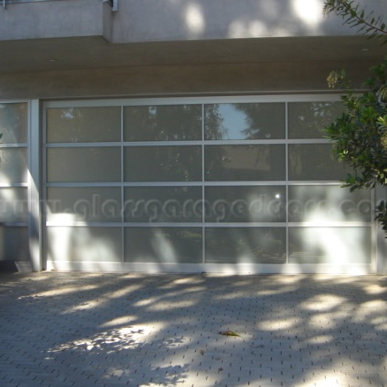 Elegant glass garage doors in Santa Monica, California, enhancing the exterior of a contemporary home