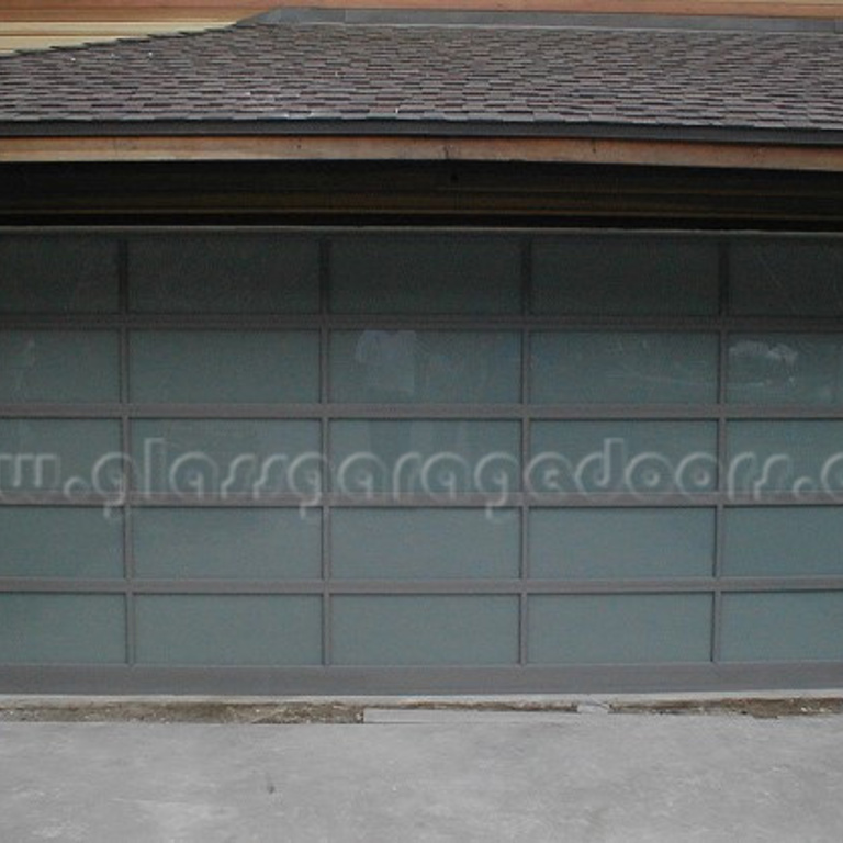 gray glass garage door on a residence on Roscomore Road, Los Angeles, California