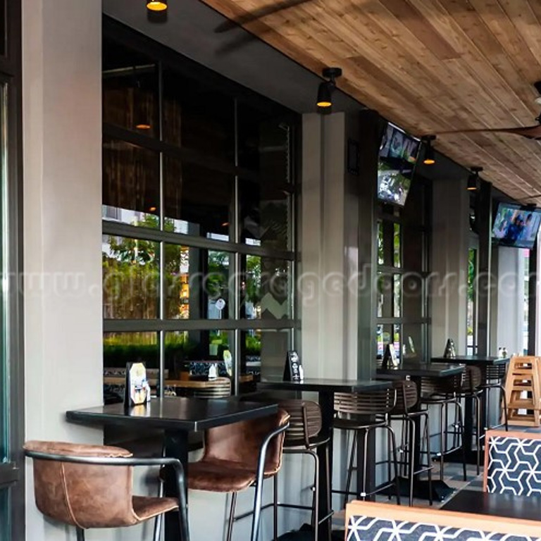 two Glass Garage Doors located  in a miami florida bar