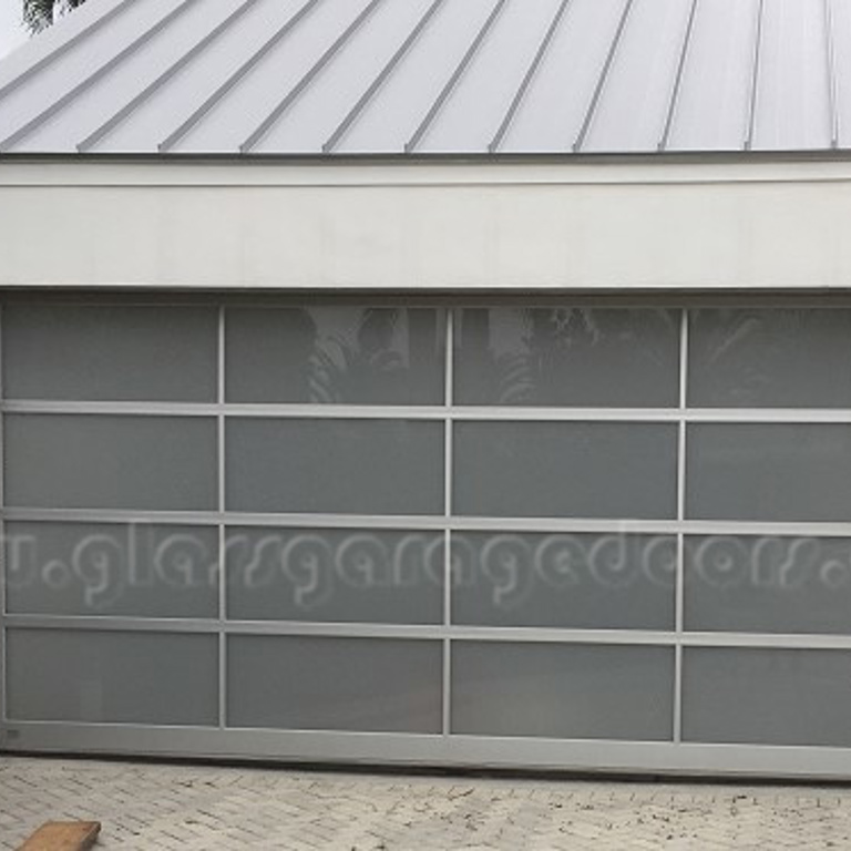 Hurricane rated with insulated frame glass garage door in miami home driveway