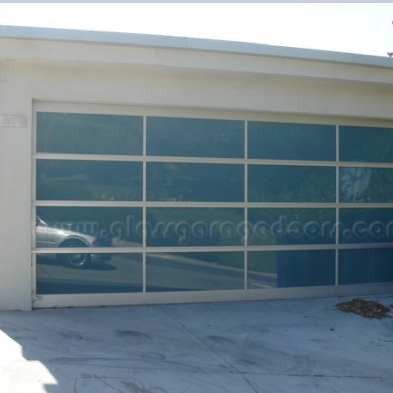 Residential glass garage door installed on a modern home in Pacific Palisades