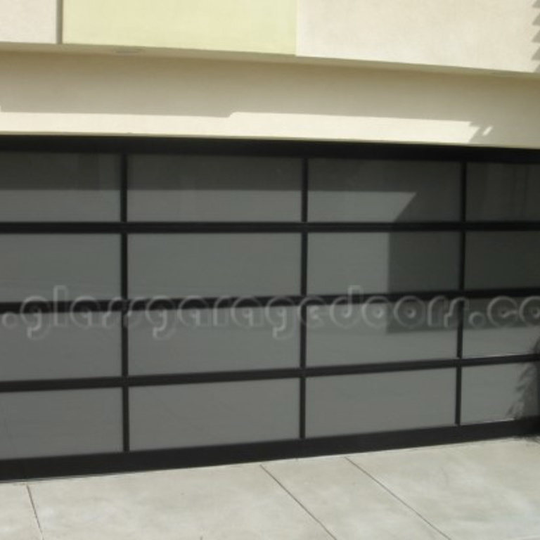 Black glass garage door on Alma Avenue in  Manhattan Beach, California 90266