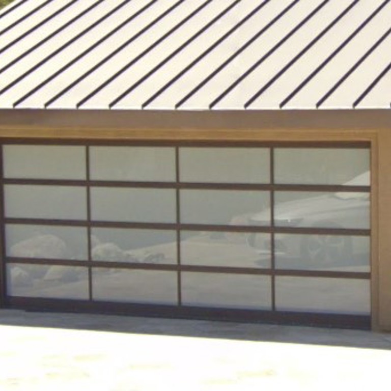 Elegant dark glass garage door installation in Rancho Mirage