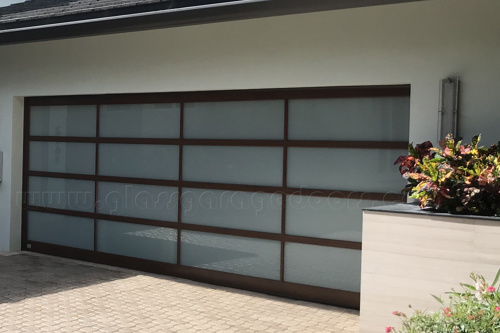 Premium hurricane-rated glass garage door enhancing security and style in a Fort Lauderdale luxury residence