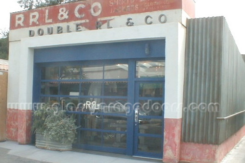 Blue Glass Garage Door with single entry gate in clothing store