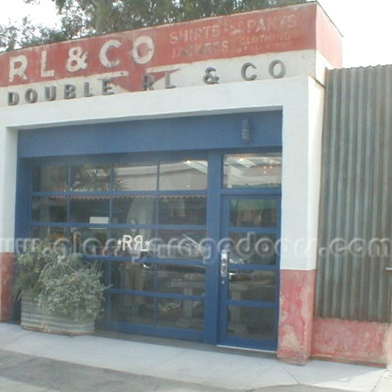 Blue Glass Garage Door with single entry gate in clothing store