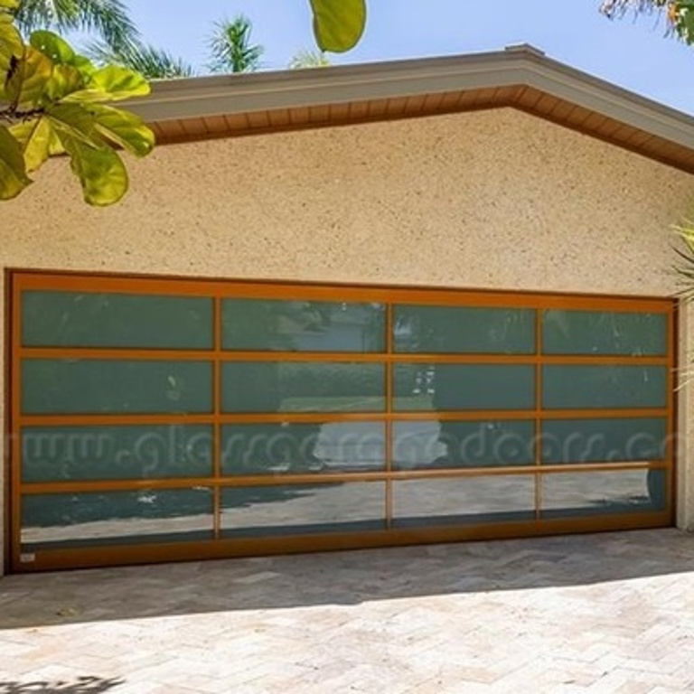 Hurricane-rated glass and aluminum panel garage door enhancing luxury Palm Harbor residence