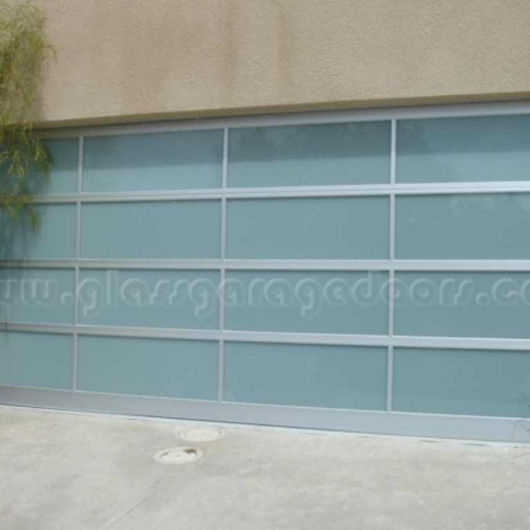 Modern residential glass garage door in San Diego, California, enhancing contemporary home design.