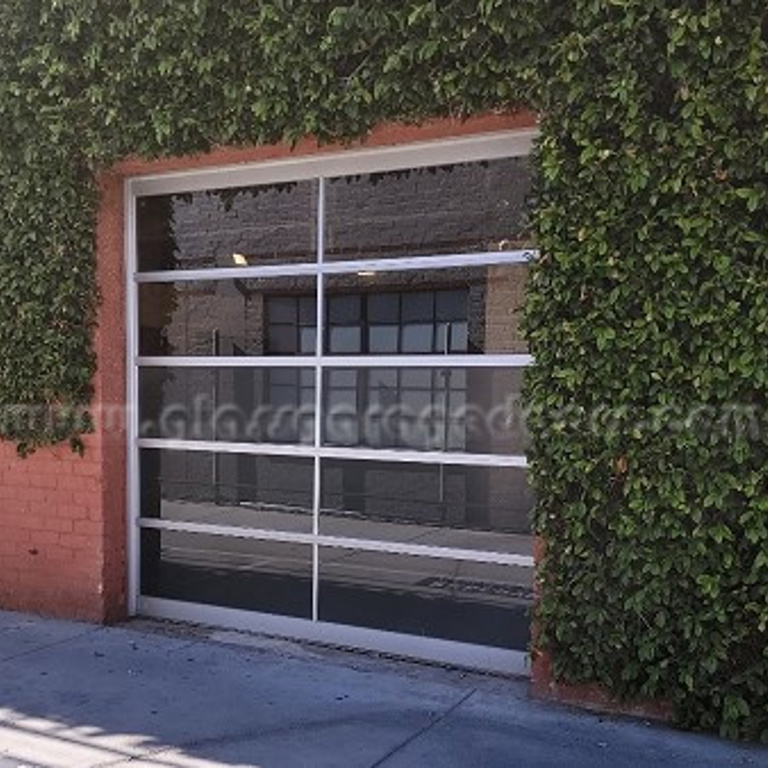 custom glass garage door installation for contemporary commercial building in Santa Monica