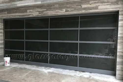 Premium hurricane-resistant glass and aluminum panel garage door for upscale Florida residence