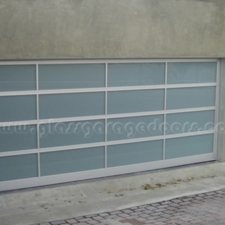 Premium glass garage door in Laguna Beach, California, enhancing the sleek and modern architecture of a luxury residence