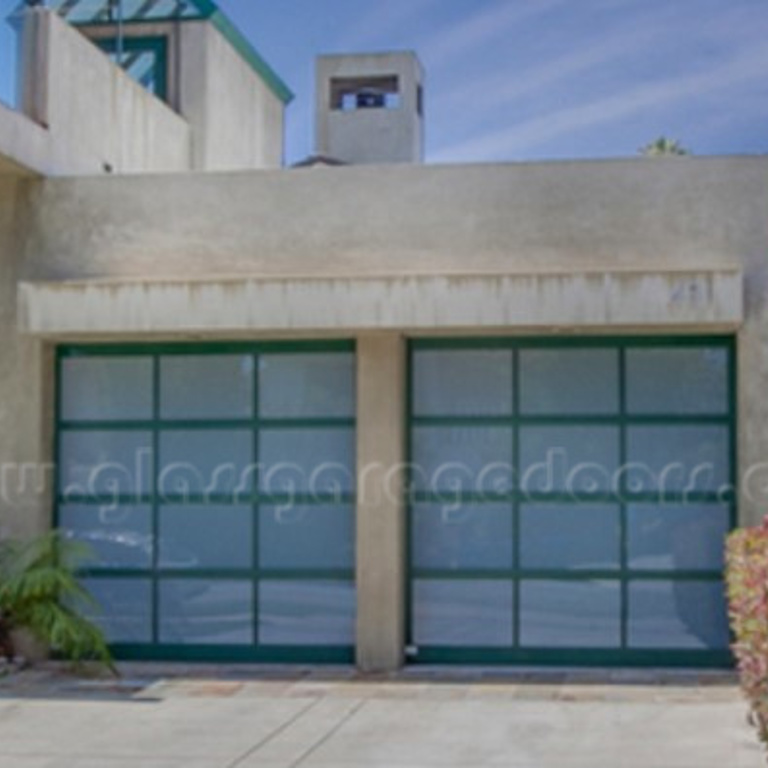 Stylish green glass garage doors on N Croft Avenue, Los Angeles, showcasing modern architecture and urban design