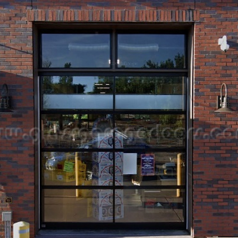 Energy-efficient insulated overhead glass door in a grocery store, providing temperature control while maintaining visibility and easy access