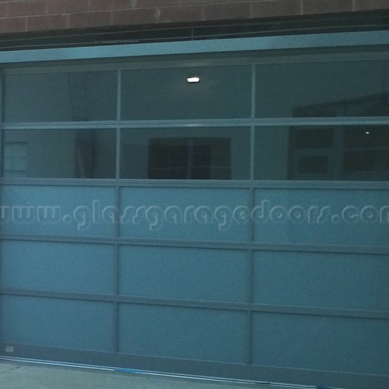 Glass garage doors in Santa Monica, California, installed in a commercial building for a sleek, functional look