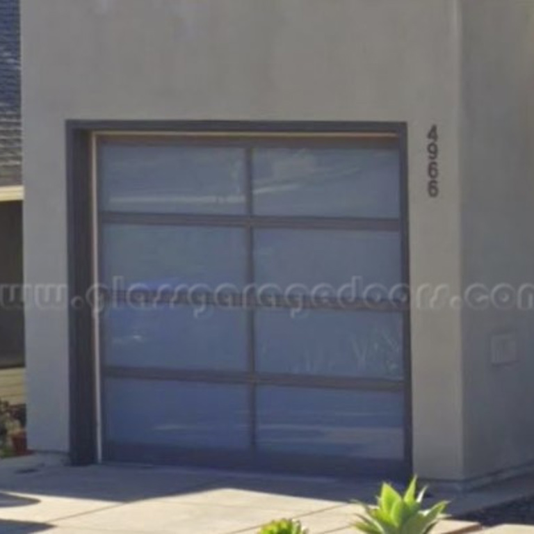 house garage with a contemporary glass garage door on Mountain View Dr in San Diego California