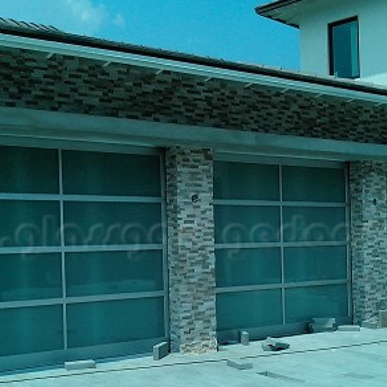 Triple set of glass garage doors in luxury residence in Fort Lauderdale florida