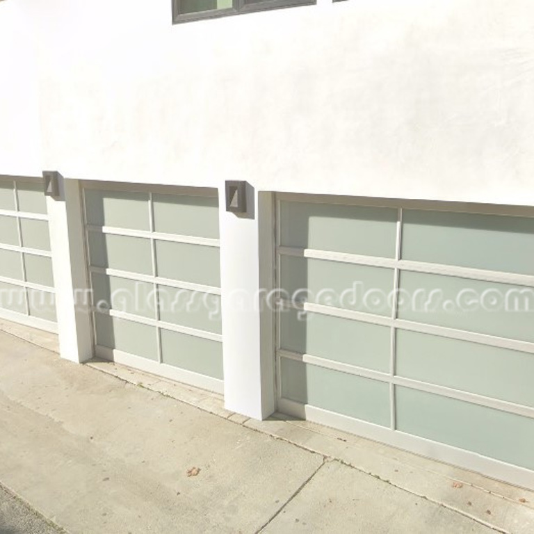 Elegant trio of glass garage doors on upscale residential building in Marina del Rey California