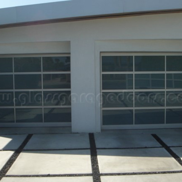 Pair of glass garage doors installed in palms springs residence