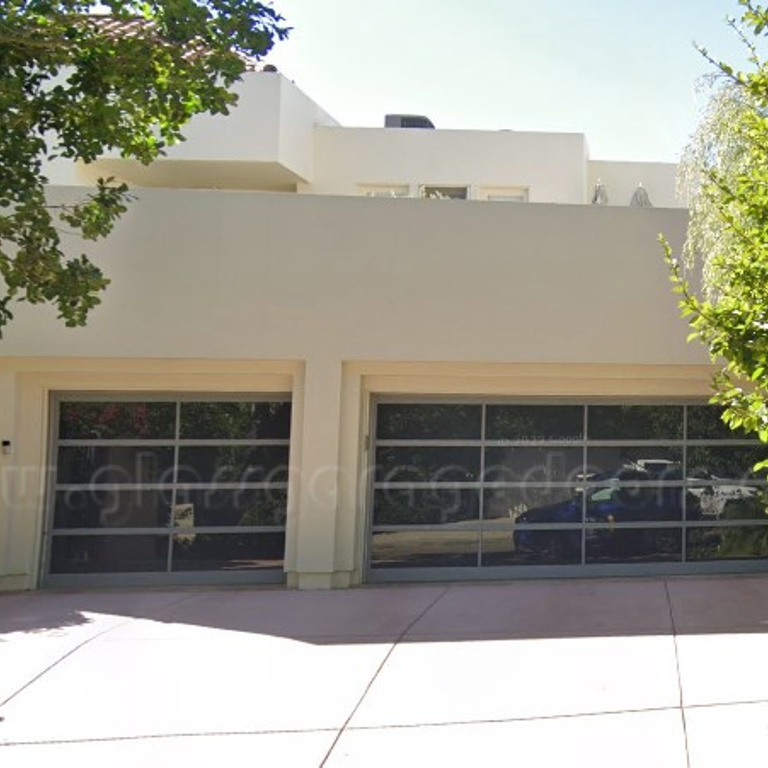 Residentail Glass Garage Door in Gray color Powder coating located in driveway on Roberto Lane in Los Angeles, California