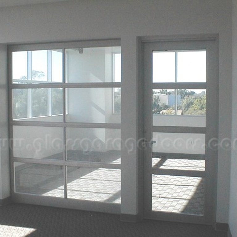 Interior view of glass garage door storefront in Newport Beach office building