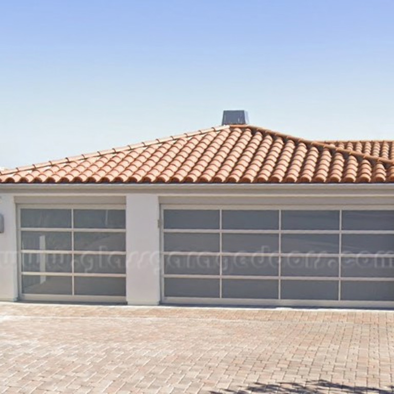 Residential aluminum glass garage door with a modern design in Rancho Mirage