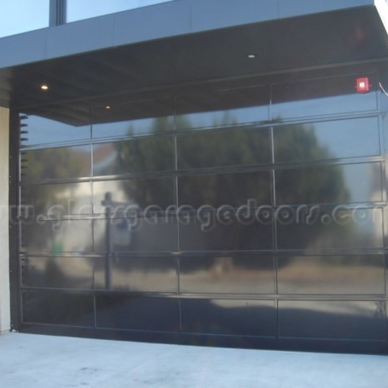 Full Aluminum sectional overhead door in black powder coated on Fisher Avenue in Manhattan Beach, California