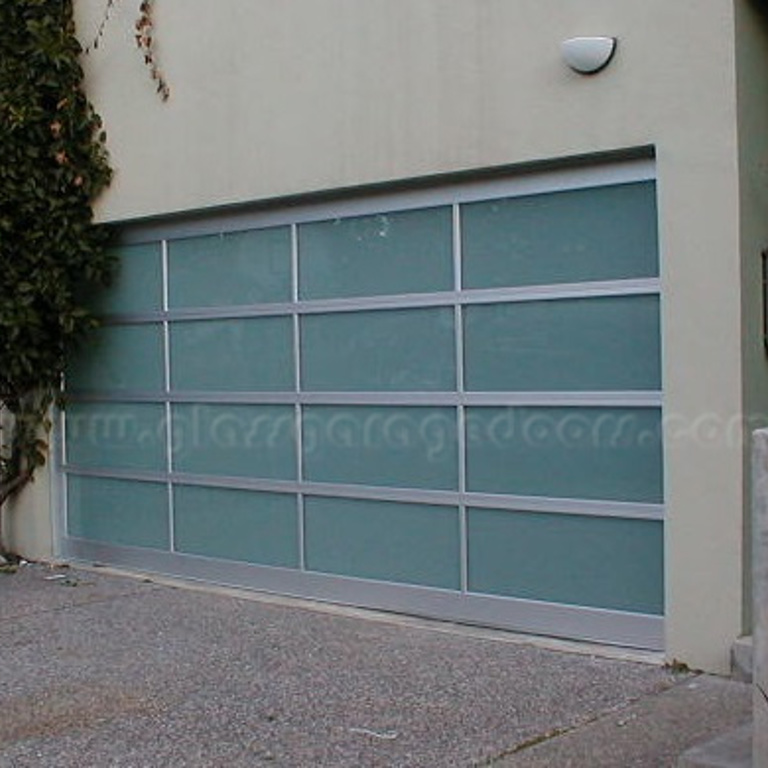 Residential glass garage door installation in Pacific Palisades California home