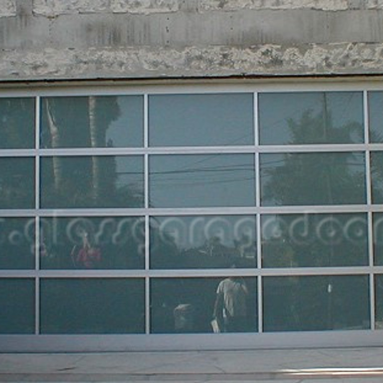 Modern glass garage door on Duncan Avenue in  Manhattan Beach, California, enhancing the coastal home's aesthetic.