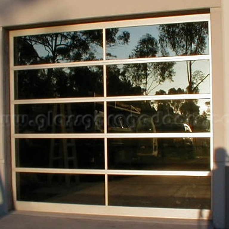 Modern glass garage door installation in an office building in San Diego